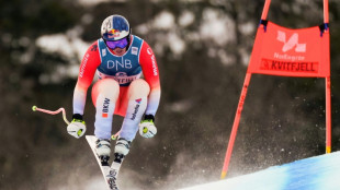 Von Allmen edges Odermatt in downhill to keep title battle alive