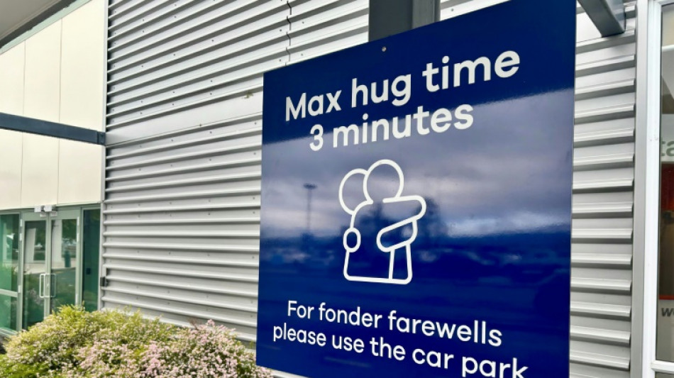 New Zealand airport sets three-minute limit on hugs