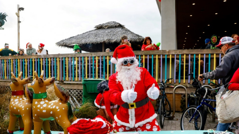 Surfing Santas ride waves, raise funds in Florida