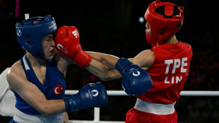 Taiwan boxer in Olympics gender row into final after 'tough journey'