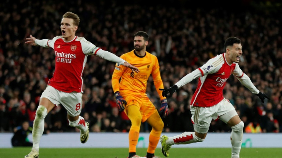 Alisson blunder helps Arsenal rock Liverpool as title race ignites