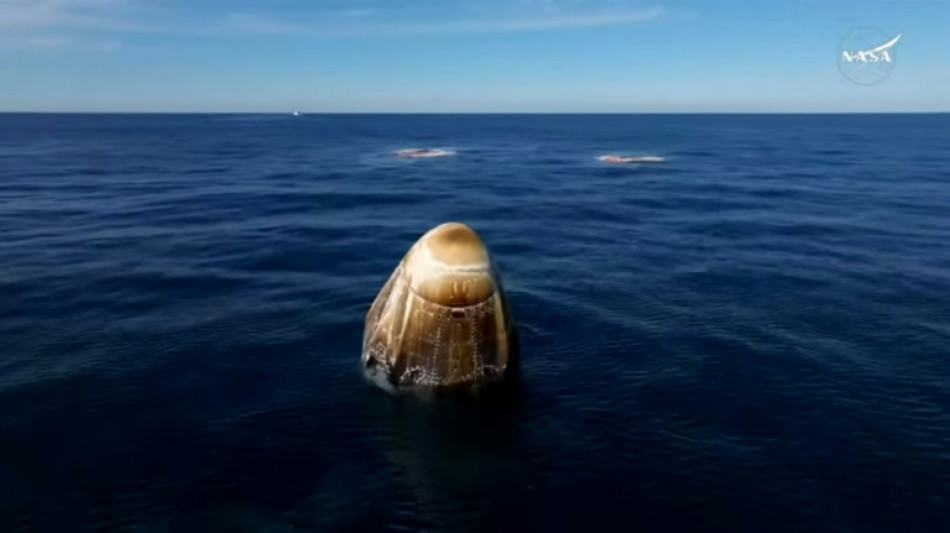 Smiles, thumbs ups and a safe return for 'stranded' NASA astronauts