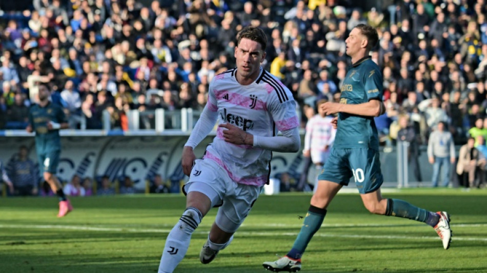 Vlahovic fires Juve one point behind leaders Inter