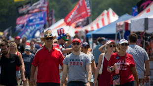 Trump evacuated from rally stage after apparent shots heard