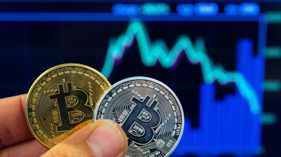 Stocks diverge; bitcoins hits fresh record high