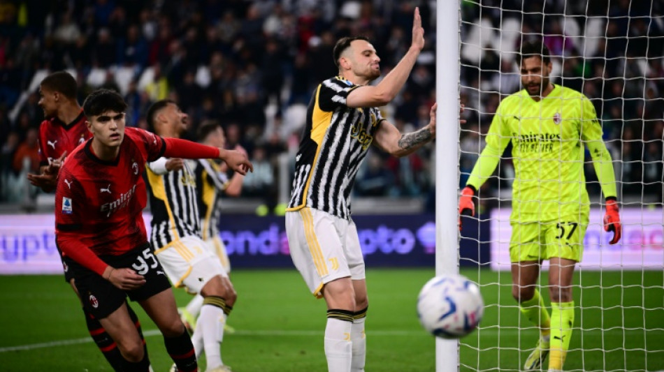 Depleted Milan hold Juve to close in on Champions League