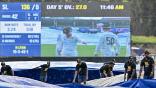 Downpour halts Sri Lanka Test as Australia tighten grip
