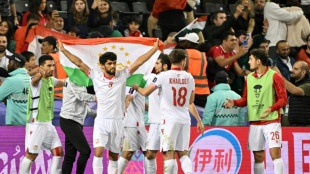 Debutants Tajikistan reach Asian Cup knockouts, China on brink