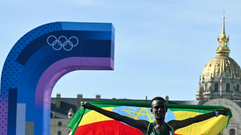 Ethiopia's Tola wins Olympic marathon as China sweeps diving golds