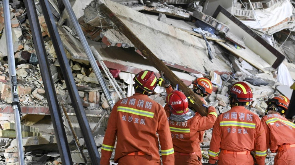 Eighth survivor recovered from China building collapse site as rescue hopes dim