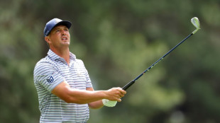 DeChambeau fires 65 to lead Scheffler by one at Masters 