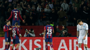 Barca edge past Napoli to make Champions League quarters return