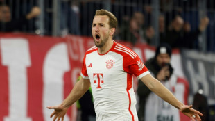 Kane brace helps Bayern keep pace with leaders Leverkusen