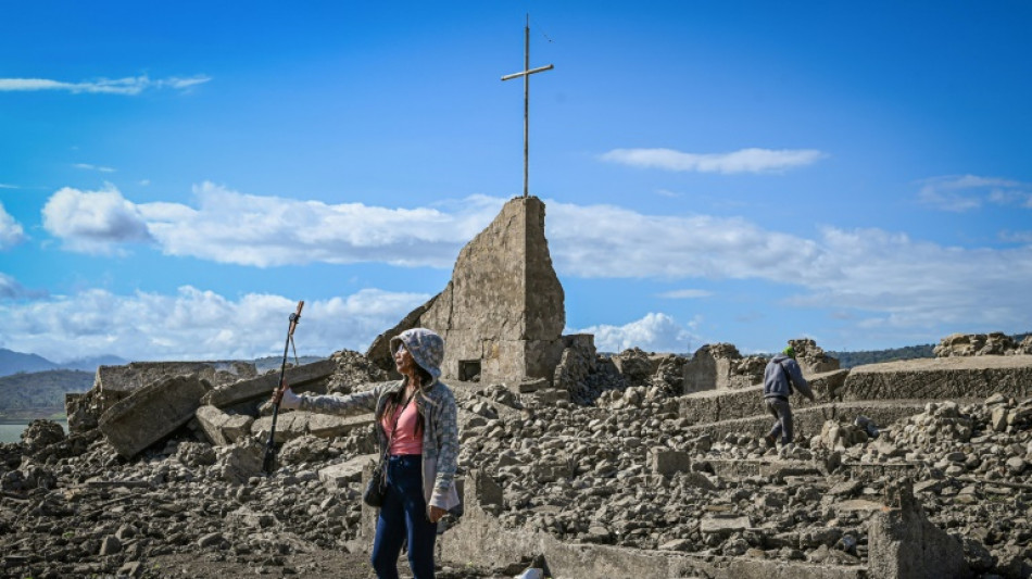 Philippine settlement submerged by dam reappears due to drought