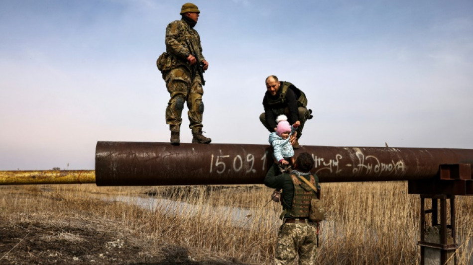 Ukrainian girl's risky pipeline dash from Russians