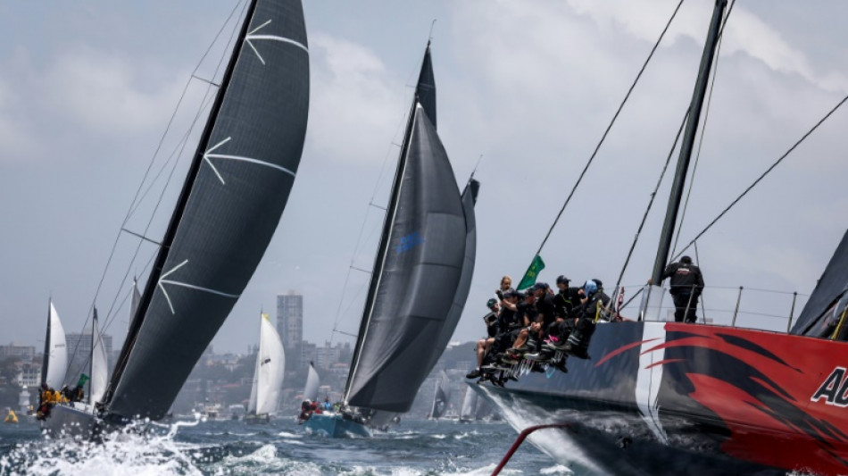 Duo battle for lead as storms force eight out of Sydney-Hobart