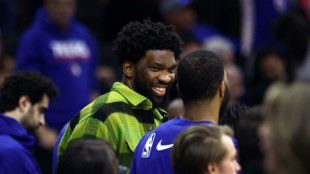 MVP Embiid out for at least a month after knee surgery