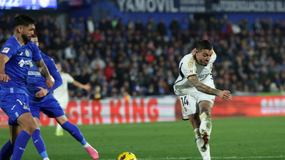 Joselu double sends Madrid top at Getafe