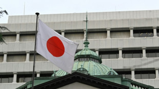 Yen drops, stocks mixed as Japan hikes rates at last