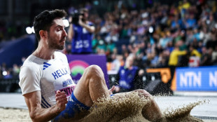 Tentoglou retains indoor long jump title, Holloway cruises