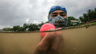 Malaysian veteran dives water hazards for sunken golf treasure