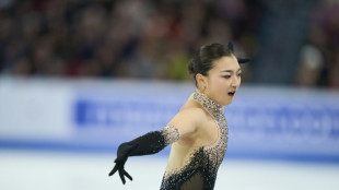 Japan's Sakamoto wins third straight figure skating women's world title