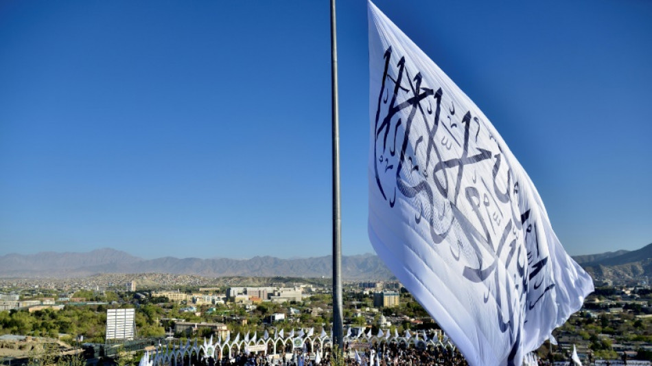 Taliban hoist giant flag in Afghan capital, eight months after return 