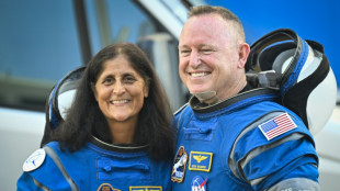 Two astronauts stranded on space station to touch down early