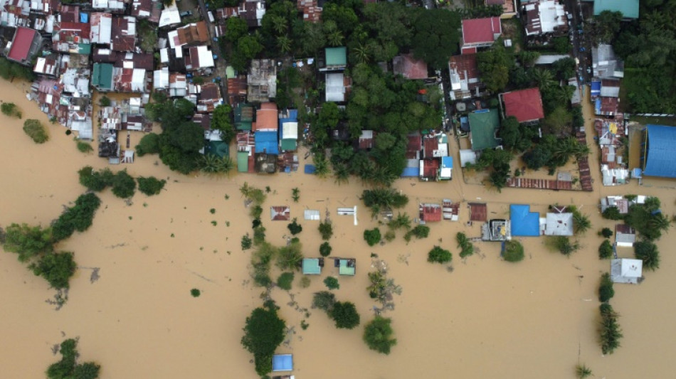 Floods hit northern Philippines after typhoon forces dam release 