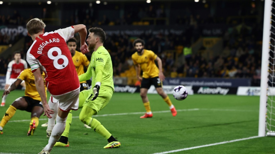 Arsenal grind out Wolves win to go top of Premier League