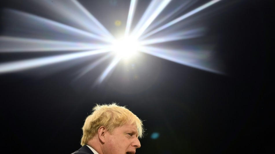 UK's wounded Johnson fights on despite Tory revolt