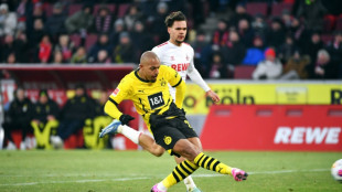 Malen scores brace as Dortmund beat Cologne despite chocolate coin protest