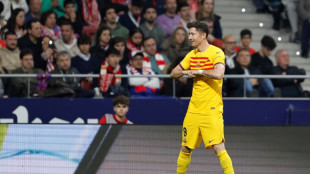 Lewandowski-powered Barca thrash Atletico to stay in title race