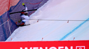 Kilde recovering after heavy crash, with Shiffrin at his side