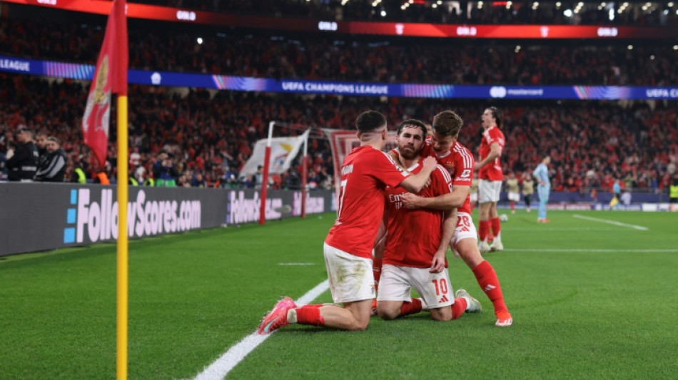 Benfica hold off Monaco to reach Champions League last 16