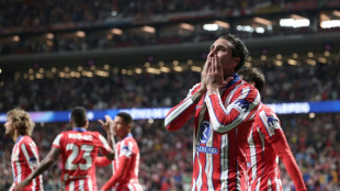 Last-gasp Gimenez strike sends Atletico past Leipzig