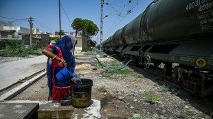 Waiting for the water train in scorching India