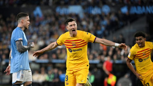 Lewandowski double snatches tame Barca win at Celta