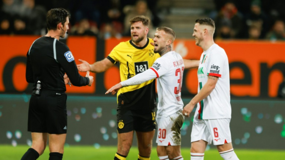 Dortmund's poor run continues with draw at Augsburg