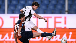 Revived Vlahovic shoots Juve top with double at fan-less Genoa