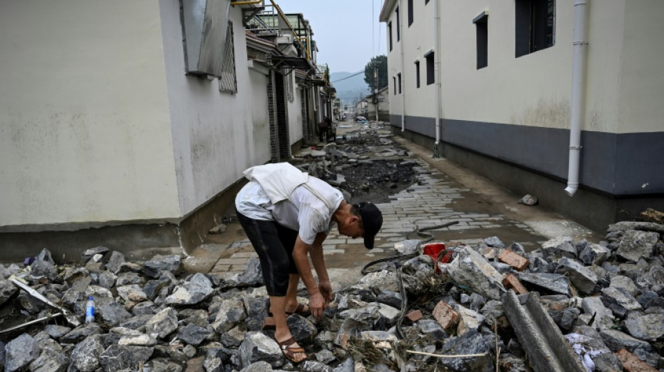 Seven killed in SW China floods as Beijing triples rain death toll