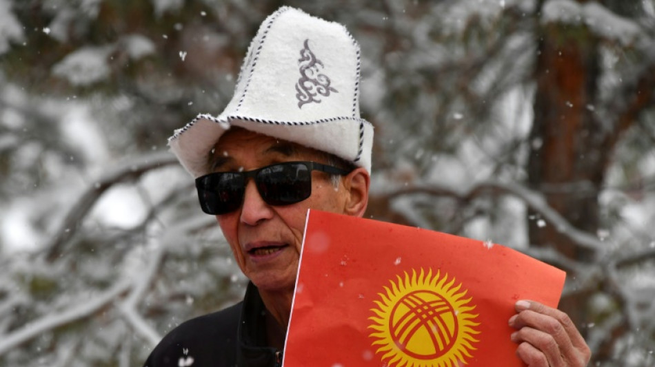 Kyrgyzstan backs new flag, says 'smiling' sun to aid growth