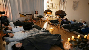 China's young workers nap away their worries with singing bowls