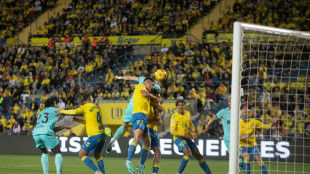 Late Gundogan penalty keeps Barca title defence alive at Las Palmas