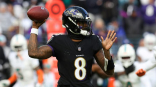 Ravens crush Miami to take AFC top seed, 49ers grab NFC top spot