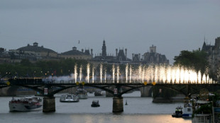 Teams sail down Seine in rain-soaked Olympics opening ceremony