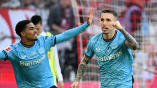 Leverkusen extend Bundesliga lead to 10 points with derby win